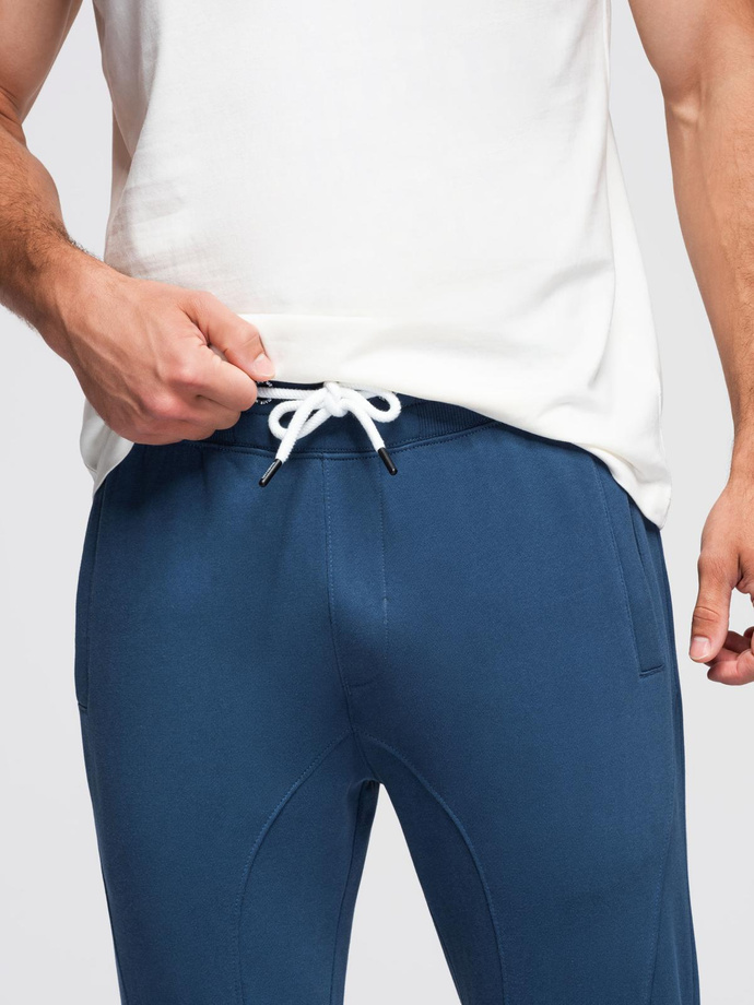 Spodnie męskie dresowe typu jogger - granatowe V4 OM-PABS-0173