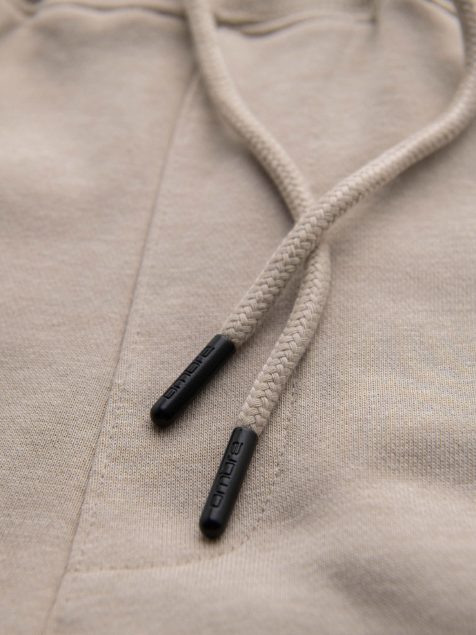 Męskie spodnie dresowe joggery - beżowe V3 OM-PASK-0280