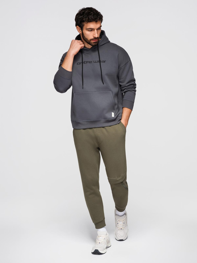 Spodnie męskie dresowe z przeszyciem i zamkiem na nogawce - oliwkowe V3 OM-PASK-0147