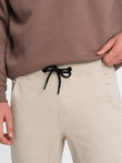 Spodnie męskie materiałowe JOGGERY - beżowe V10 P885