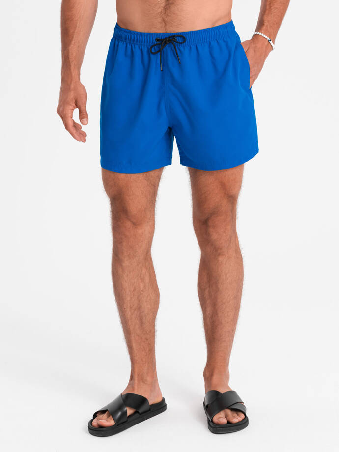 Neonowe męskie szorty kąpielowe z efektem magic print – niebieskie V3 OM-SRBS-0147