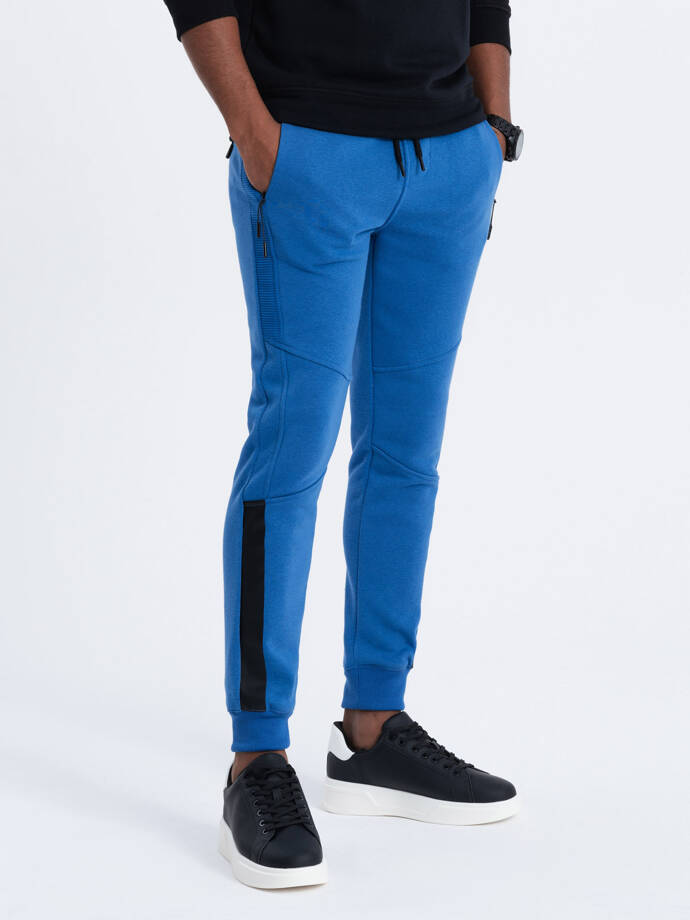 Spodnie męskie dresowe z przeszyciami - niebieskie V8 OM-PASK-0137
